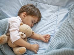 Cute little kid sleeping. Little boy sleeping in bed Cute little boy sleeping, tired child taking a nap in his small bed, clean, fresh and cozy bedding sheets, bedtime for kids